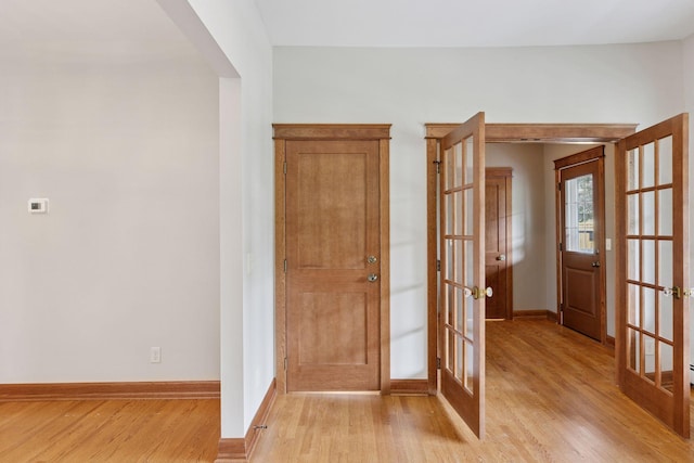704-706 Holly Ave, Saint Paul, MN 55104 - entrance foyer featuring french doors and light wood-style flooring