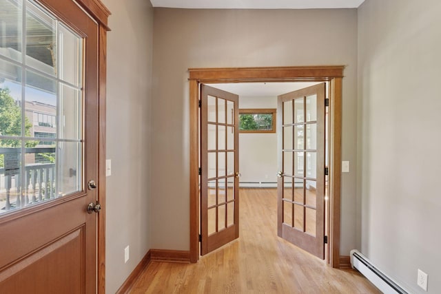 704-706 Holly Ave, Saint Paul, MN 55104 - doorway to outside featuring a baseboard radiator, french doors, and healthy amount of natural light