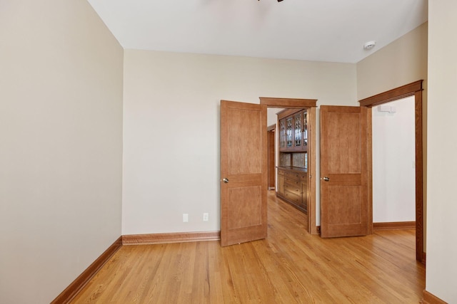 704-706 Holly Ave, Saint Paul, MN 55104 - spare room with light wood finished floors and a smoke detector