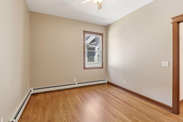 704-706 Holly Ave, Saint Paul, MN 55104 - empty room featuring a baseboard heating unit, ceiling fan, and light wood finished floors