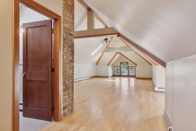 704-706 Holly Ave, Saint Paul, MN 55104 - additional living space featuring baseboard heating, light wood-type flooring, a ceiling fan, and vaulted ceiling