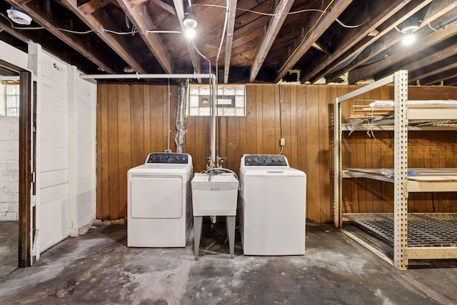 704-706 Holly Ave, Saint Paul, MN 55104 - below grade area featuring washer and dryer and wooden walls