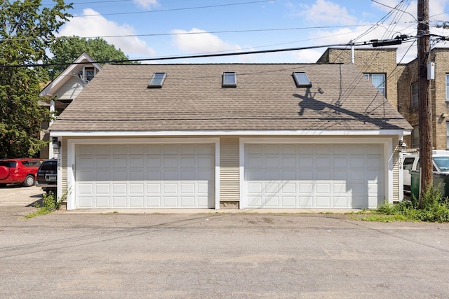 704-706 Holly Ave, Saint Paul, MN 55104 - view of front facade featuring a shingled roof and a garage