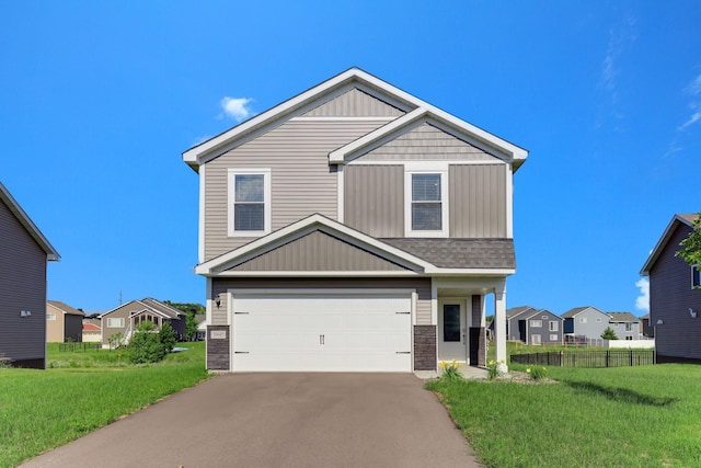 39685 Fallbrook Ave, North Branch, MN 55056 - view of front facade featuring an attached garage, asphalt driveway, stone siding, and a residential view