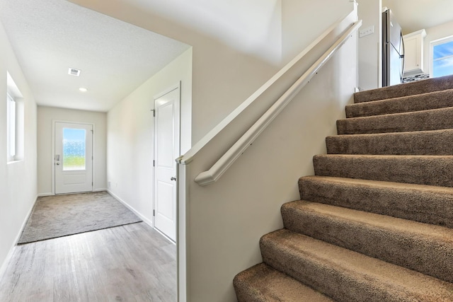 39685 Fallbrook Ave, North Branch, MN 55056 - entryway with stairs and light wood-style floors