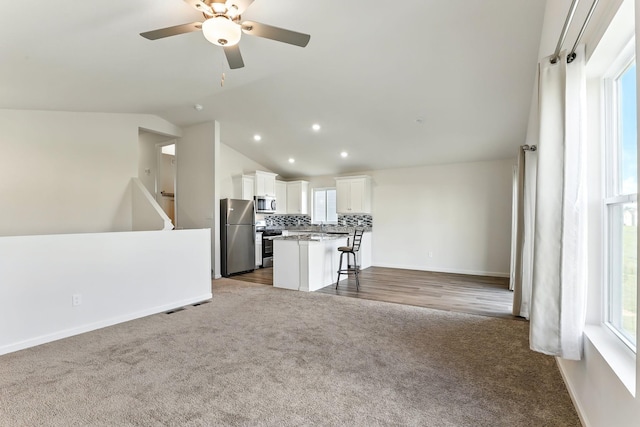39685 Fallbrook Ave, North Branch, MN 55056 - living room with carpet, a ceiling fan, lofted ceiling, and recessed lighting