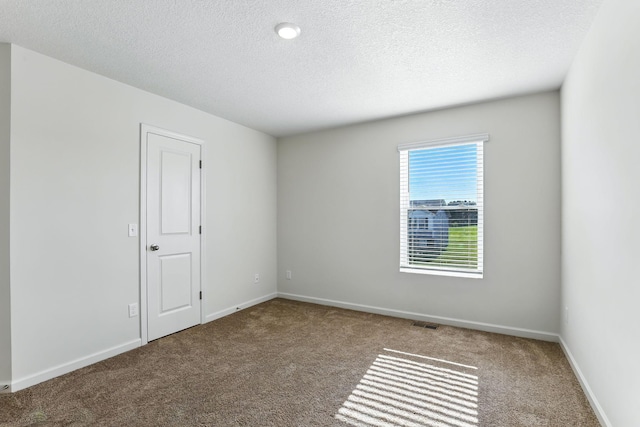 39685 Fallbrook Ave, North Branch, MN 55056 - carpeted spare room featuring a textured ceiling and baseboards