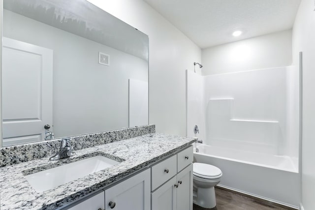 39685 Fallbrook Ave, North Branch, MN 55056 - bathroom with wood finished floors, vanity, and washtub / shower combination