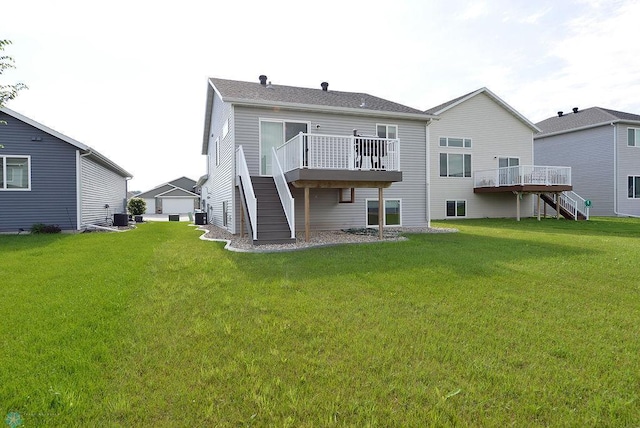 8037 Goldfinch Dr, Horace, ND 58047 - rear view of house with stairway, a wooden deck, and a lawn