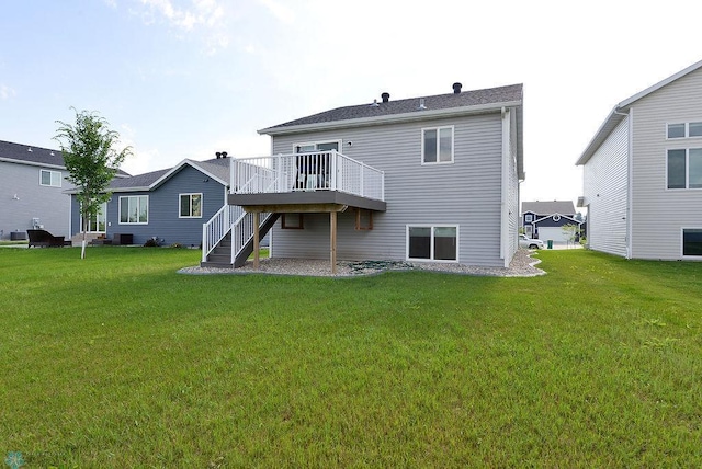 8037 Goldfinch Dr, Horace, ND 58047 - rear view of property with stairway, a wooden deck, and a lawn