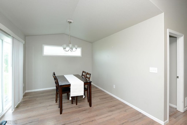 8037 Goldfinch Dr, Horace, ND 58047 - dining area with a chandelier, light wood-type flooring, and vaulted ceiling
