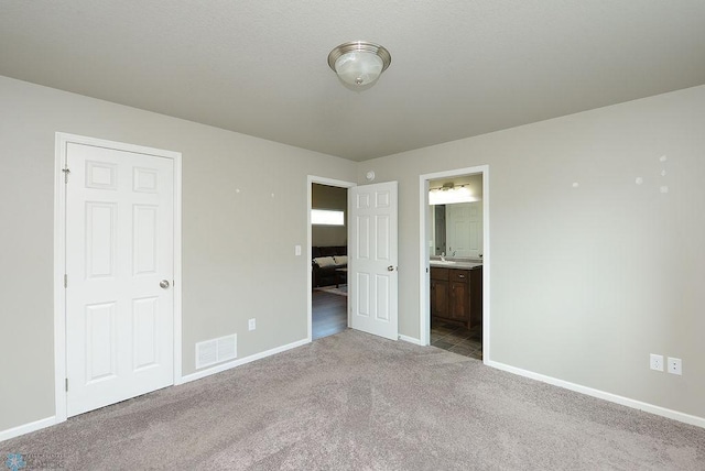 8037 Goldfinch Dr, Horace, ND 58047 - unfurnished bedroom with carpet floors and ensuite bath