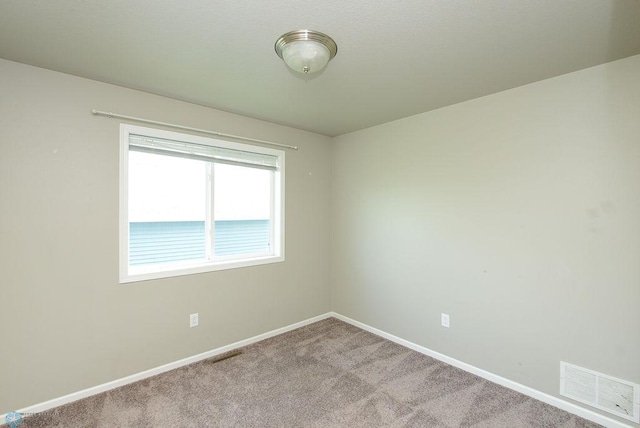 8037 Goldfinch Dr, Horace, ND 58047 - carpeted spare room with baseboards