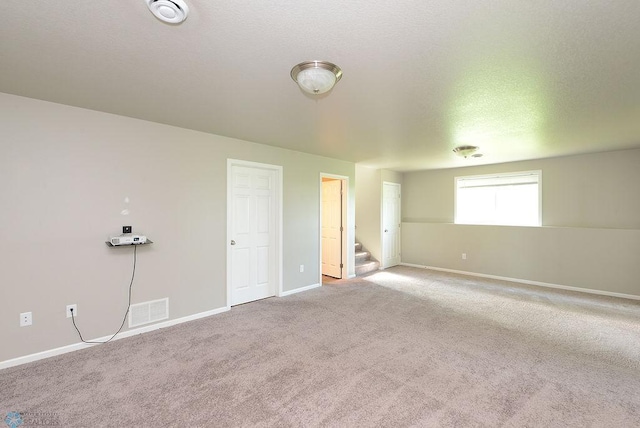 8037 Goldfinch Dr, Horace, ND 58047 - carpeted spare room featuring stairway and a smoke detector