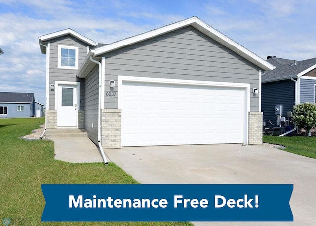 8037 Goldfinch Dr, Horace, ND 58047 - view of front facade with concrete driveway, a front lawn, an attached garage, and brick siding