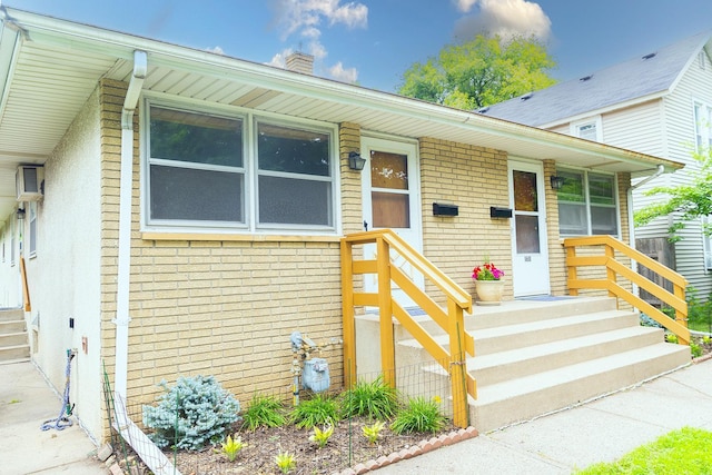 1611 Taylor Ave W, Saint Paul, MN 55104 - view of front facade with brick siding and a chimney