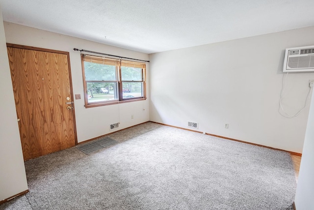 1611 Taylor Ave W, Saint Paul, MN 55104 - spare room with a wall mounted air conditioner and carpet
