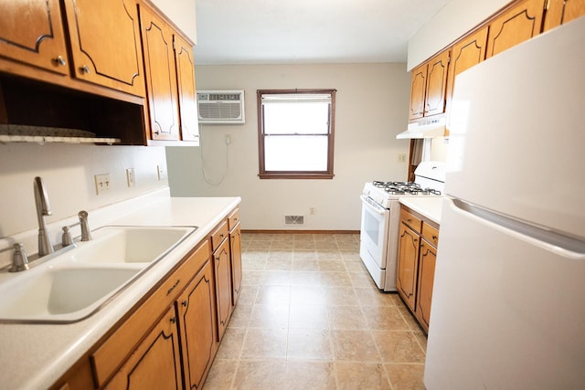 1611 Taylor Ave W, Saint Paul, MN 55104 - kitchen featuring white appliances, under cabinet range hood, an AC wall unit, brown cabinetry, and light countertops