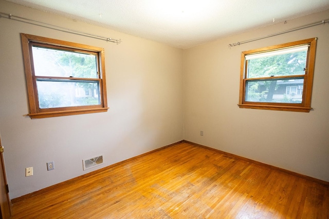 1611 Taylor Ave W, Saint Paul, MN 55104 - unfurnished room with light wood-type flooring and baseboards