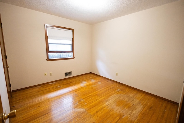 1611 Taylor Ave W, Saint Paul, MN 55104 - unfurnished room with light wood-style flooring and baseboards