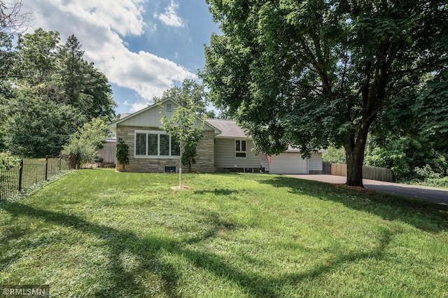 3308 Chippewa Rd, Minnetonka, MN 55305 - back of property with concrete driveway, stone siding, and an attached garage