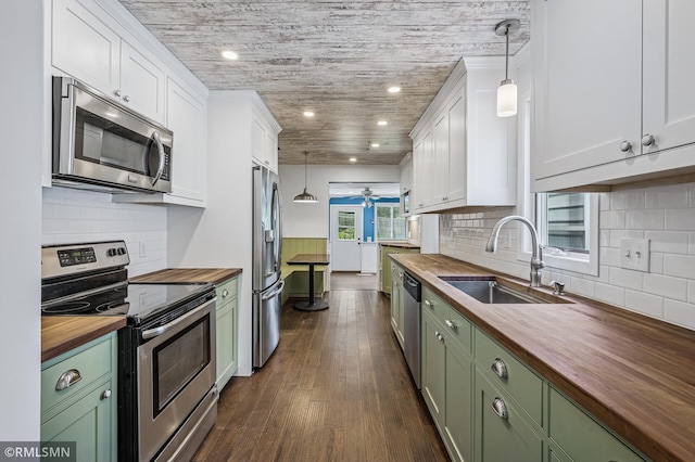 3308 Chippewa Rd, Minnetonka, MN 55305 - kitchen featuring wood counters, appliances with stainless steel finishes, green cabinetry, and recessed lighting