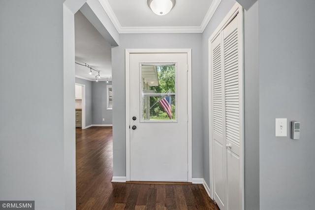 3308 Chippewa Rd, Minnetonka, MN 55305 - doorway featuring crown molding, dark wood-style flooring, and rail lighting