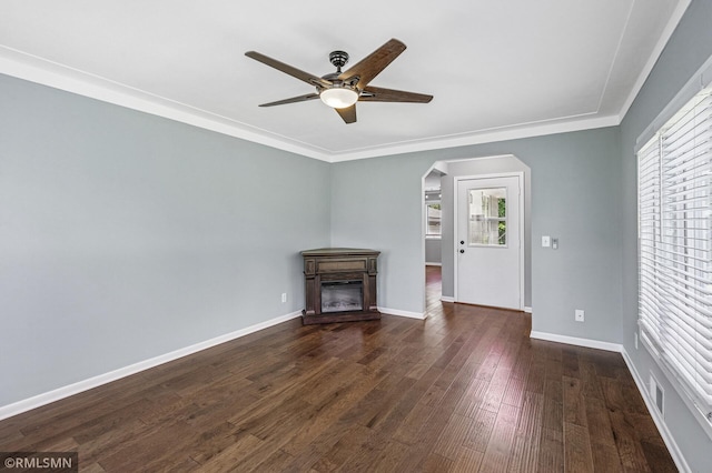 3308 Chippewa Rd, Minnetonka, MN 55305 - unfurnished living room featuring arched walkways, ceiling fan, dark wood-style flooring, a fireplace, and ornamental molding