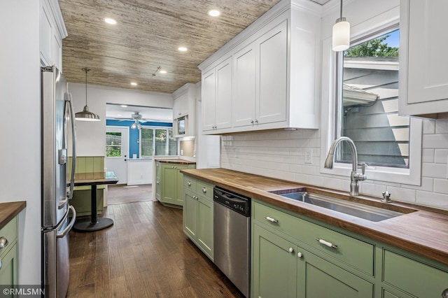 3308 Chippewa Rd, Minnetonka, MN 55305 - kitchen featuring butcher block counters, green cabinetry, appliances with stainless steel finishes, dark wood finished floors, and white cabinets