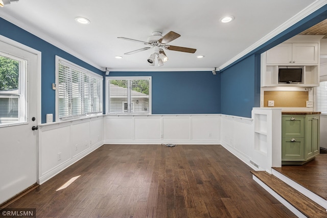 3308 Chippewa Rd, Minnetonka, MN 55305 - unfurnished dining area with ornamental molding, ceiling fan, dark wood-style floors, healthy amount of natural light, and a wainscoted wall