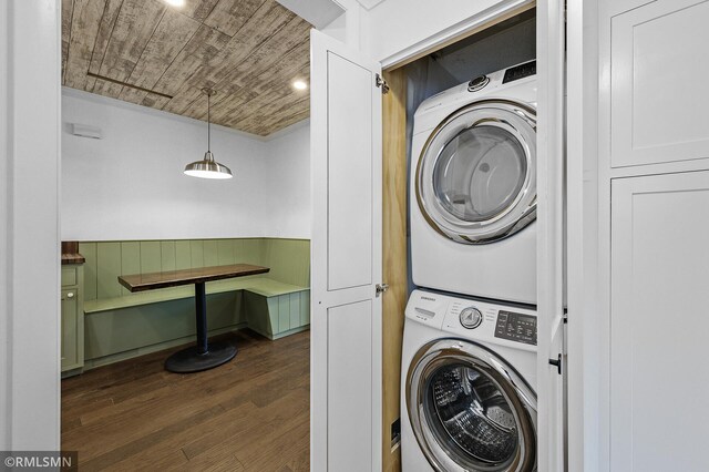 3308 Chippewa Rd, Minnetonka, MN 55305 - laundry room with estacked washer and dryer, dark wood-style flooring, and wood ceiling