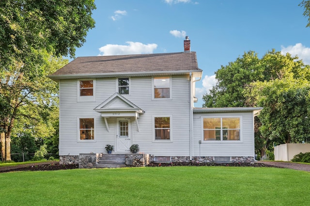 5912 Bartlett Blvd, Mound, MN 55364 - view of front facade with a chimney and a front yard