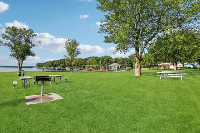 5912 Bartlett Blvd, Mound, MN 55364 - surrounding community with a lawn and a water view