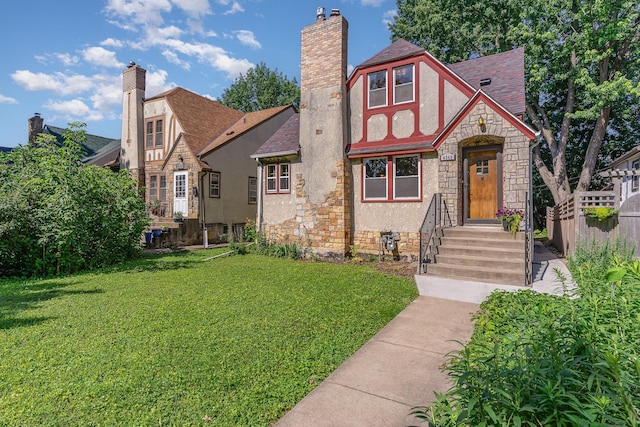 4340 Oakland Ave, Minneapolis, MN 55407 - tudor house featuring stone siding, a chimney, a shingled roof, and stucco siding