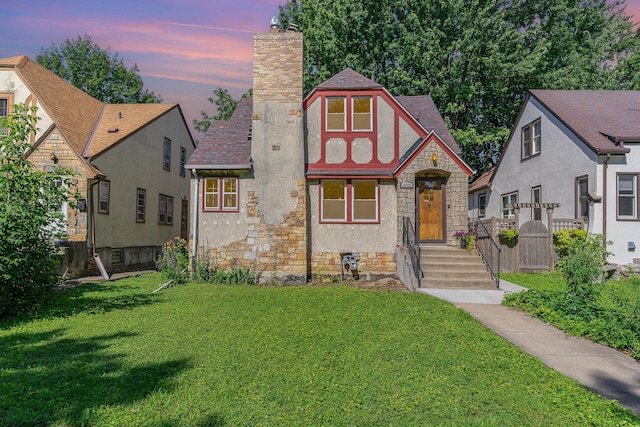 4340 Oakland Ave, Minneapolis, MN 55407 - tudor-style house with a chimney, stone siding, stucco siding, and roof with shingles