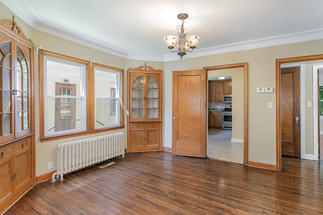 4340 Oakland Ave, Minneapolis, MN 55407 - entryway with radiator, a chandelier, wood finished floors, and crown molding