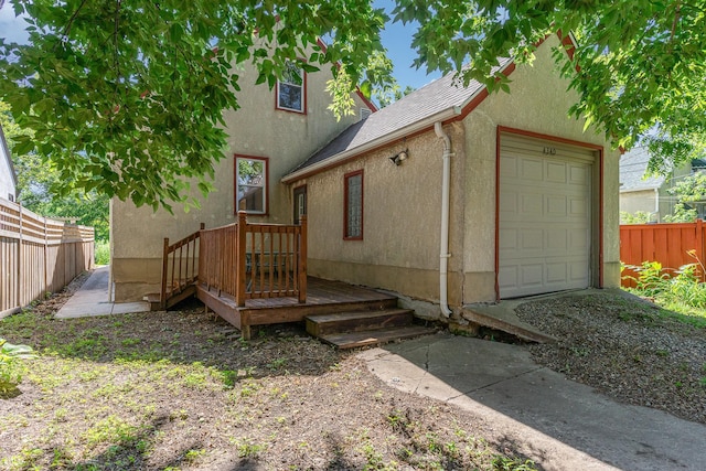4340 Oakland Ave, Minneapolis, MN 55407 - back of property featuring stucco siding and a shingled roof