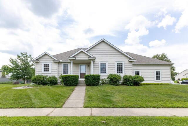 1404 8th St NW, Kasson, MN 55944 - view of front facade with a front lawn and a shingled roof