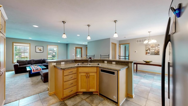 1404 8th St NW, Kasson, MN 55944 - kitchen with appliances with stainless steel finishes, open floor plan, hanging light fixtures, light colored carpet, and recessed lighting
