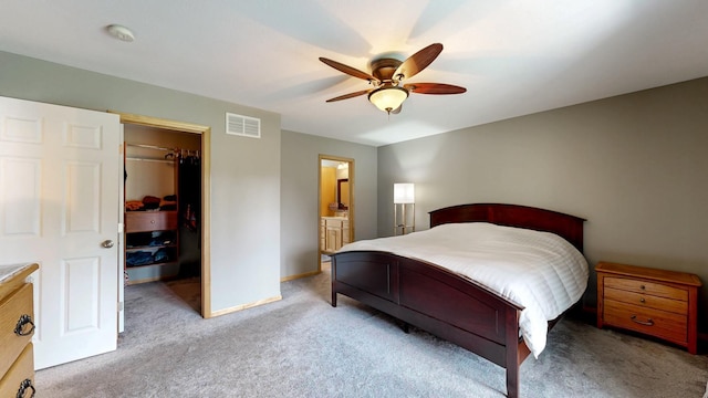 1404 8th St NW, Kasson, MN 55944 - bedroom featuring a spacious closet, carpet flooring, a ceiling fan, and connected bathroom