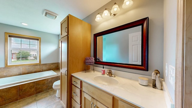 1404 8th St NW, Kasson, MN 55944 - full bathroom featuring vanity, tiled tub, and tile patterned flooring