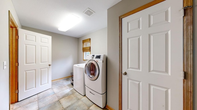 1404 8th St NW, Kasson, MN 55944 - laundry room featuring washer and clothes dryer and baseboards