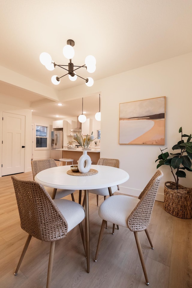 212 Diamond Lake Rd, Minneapolis, MN 55419 - dining room with a chandelier and light wood-style flooring
