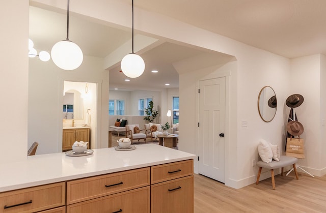 212 Diamond Lake Rd, Minneapolis, MN 55419 - kitchen featuring light wood-type flooring, light countertops, hanging light fixtures, recessed lighting, and open floor plan
