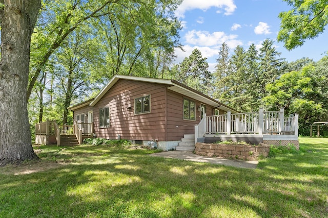 39665 8th Ave, North Branch, MN 55056 - view of side of home featuring a wooden deck and a lawn