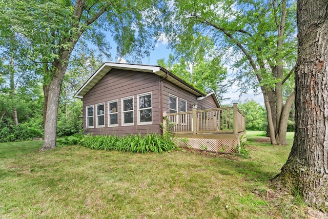 39665 8th Ave, North Branch, MN 55056 - view of side of home with a deck and a yard
