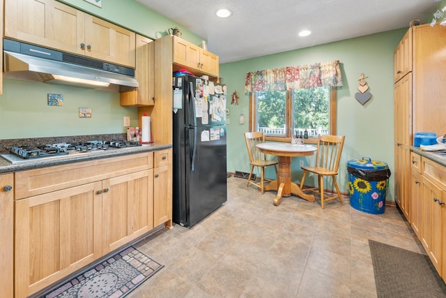 39665 8th Ave, North Branch, MN 55056 - kitchen featuring freestanding refrigerator, stainless steel gas stovetop, under cabinet range hood, light brown cabinetry, and recessed lighting