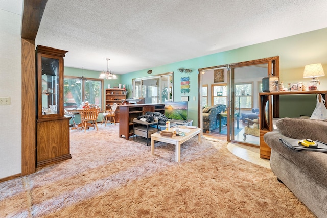 39665 8th Ave, North Branch, MN 55056 - living area featuring a chandelier, a textured ceiling, and carpet flooring