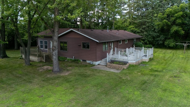 39665 8th Ave, North Branch, MN 55056 - back of house featuring a wooden deck and a yard
