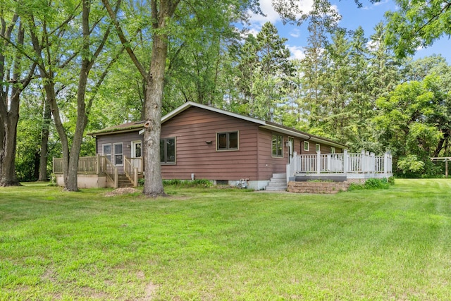 39665 8th Ave, North Branch, MN 55056 - rear view of property with a deck and a yard